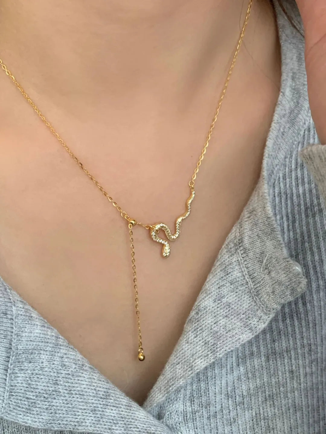 SERPENT SILVER TASSEL